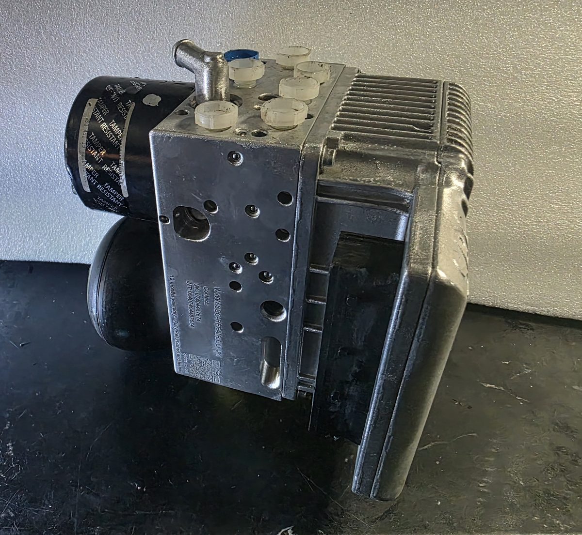 Rebuilt Mercedes SBC pump 0265960019 — hydraulic valve block and resealed motor